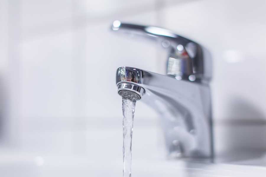 Image of a faucet and water