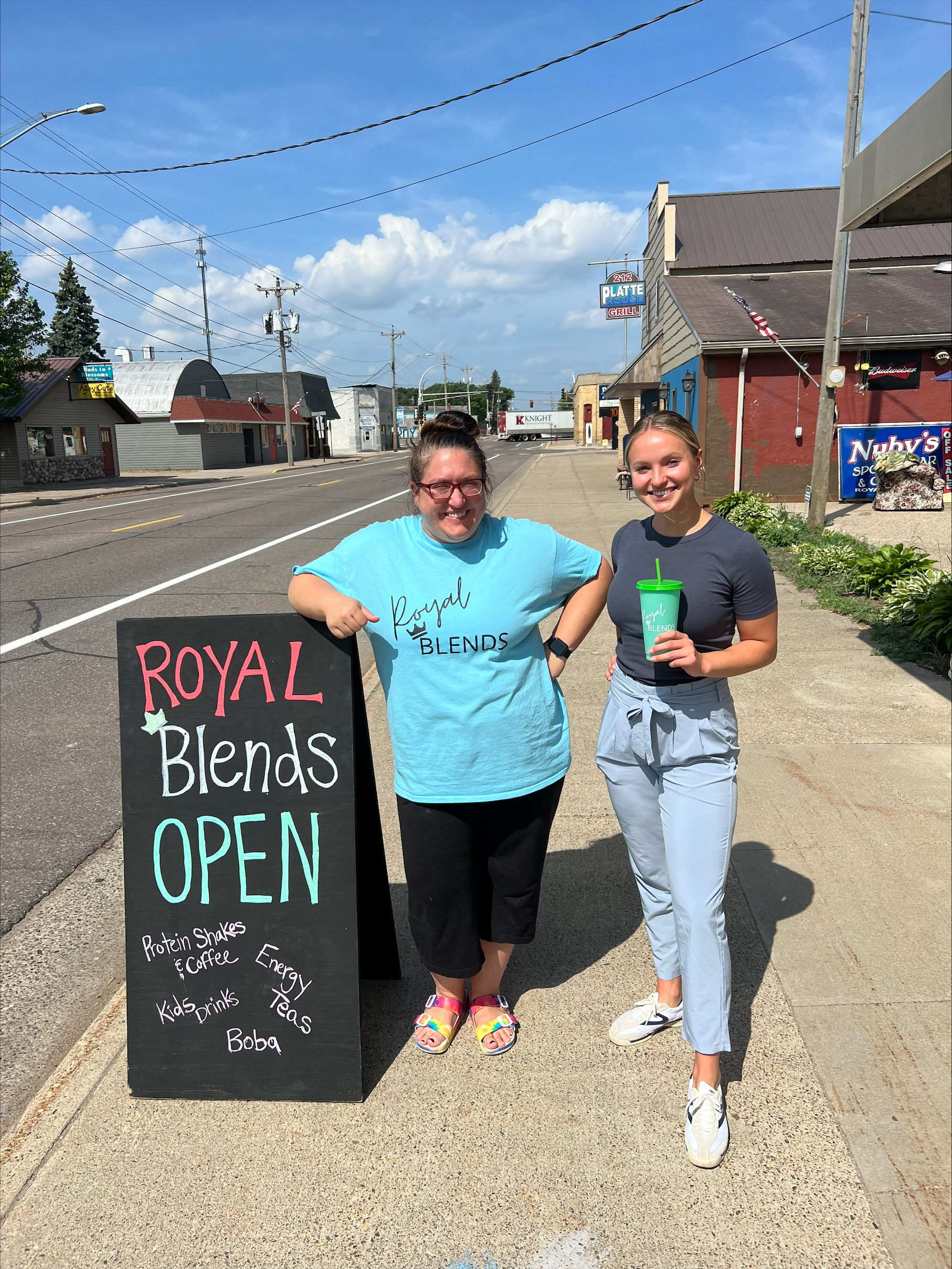 Royal Blends in Minnesota business owner and ReThink Disposable staff showing off new reusable cups