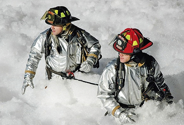 Firefighters surrounded by PFAS firefighting foam