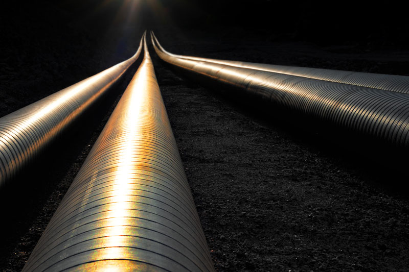 Pipelines reflecting sunset. Photo credit Amy Johansson / Shutterstock