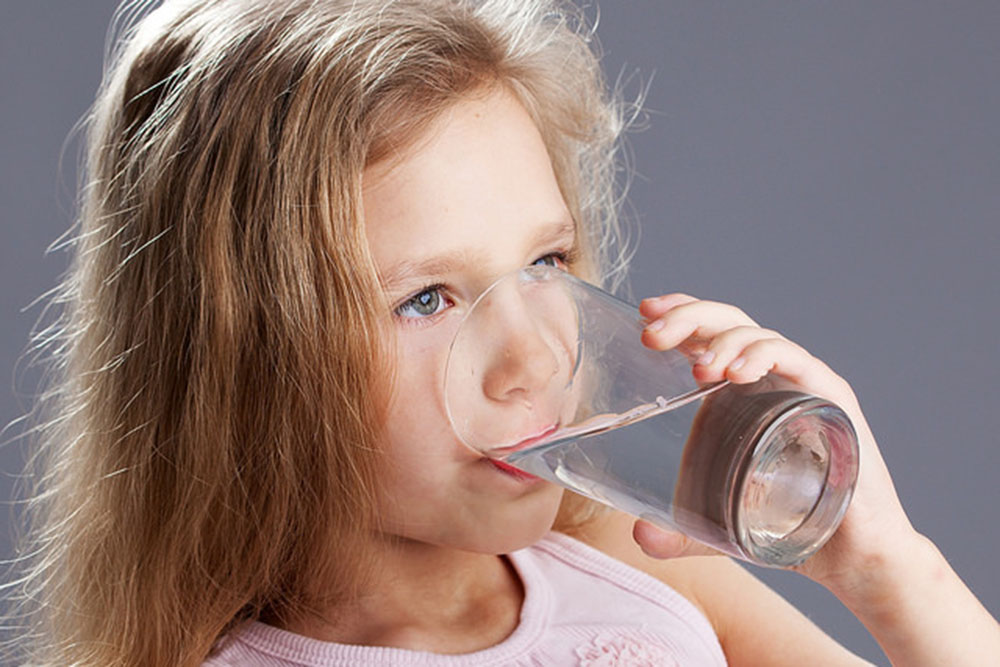 Girl drinking water, photo: Aqua Mechanical