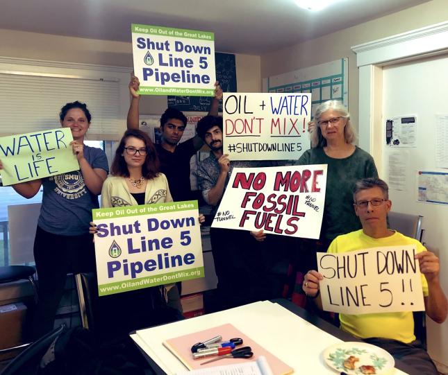 Clean Water Action volunteers with Shut Down Line 5 signs