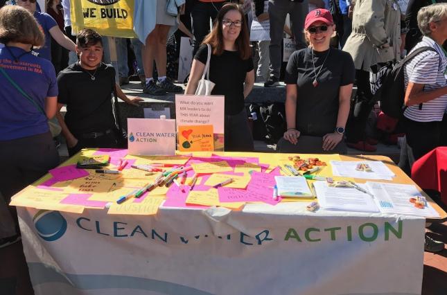 Clean Water Action table at climate march with table of letters to lawmakers.