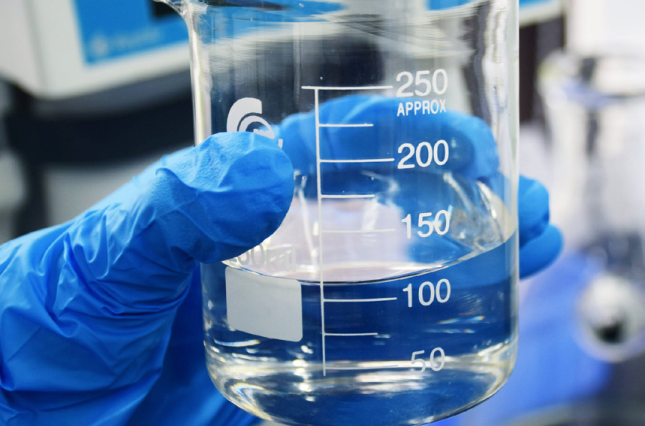 Water sample for testing held in beaker