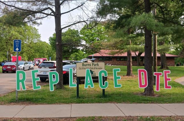 Cut out letters spelling "Replace DTE" at the 2023 Ann Arbor for Public Power Festival