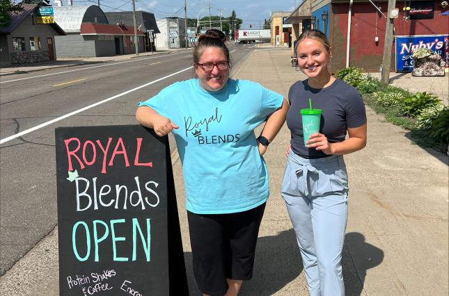 Royal Blends in Minnesota business owner and ReThink Disposable staff showing off new reusable cups