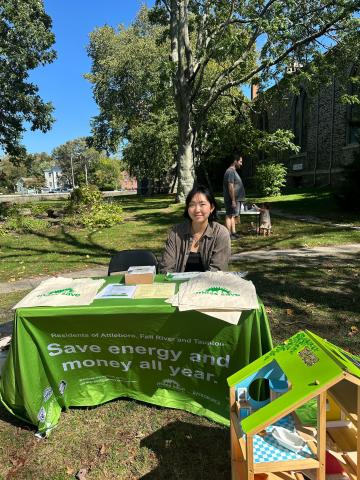 Dan Lu tabling at the Church Green Farmers Market in Taunton 