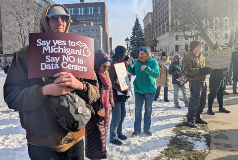 Protestors holding signs including "say yes to Michigan, say NO to data centers"