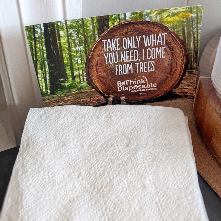 Napkin stack with sign "Take only what you need, I come from trees"