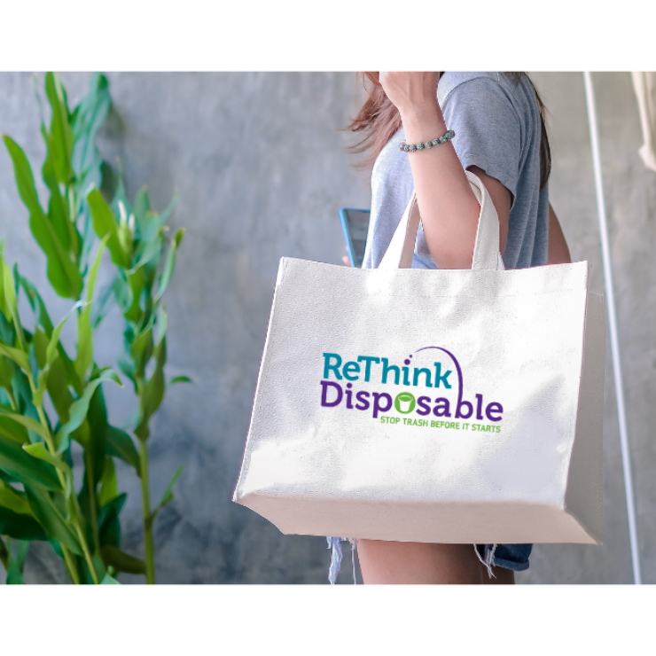 Image of someone holding a reusable bag - canva