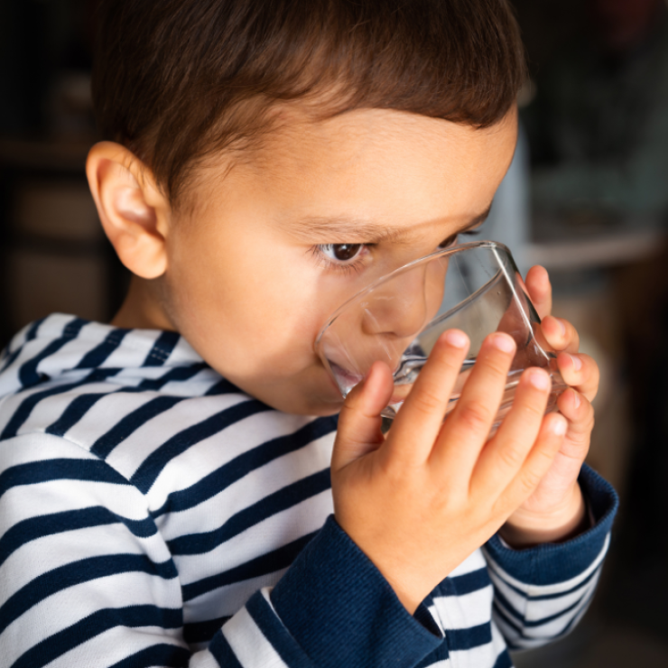 Young kid drinking water