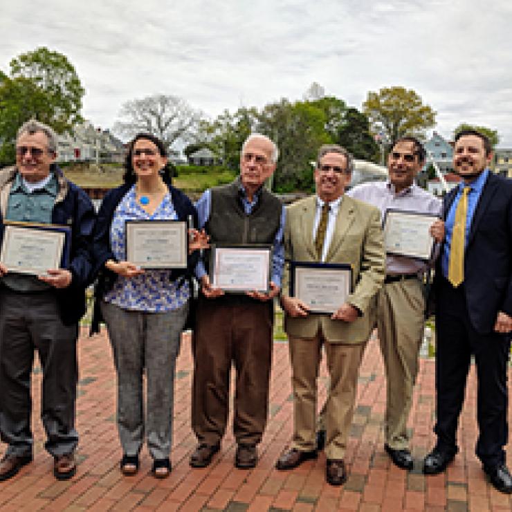 Clean Water Champions (L to R): David Silvia (accepting on behalf of his son, Andrew Silvia), Alicia Leher, Ken Payne, State Senator Josh Miller, and Jerry Elmer with Rhode Island Clean Water Action Director Johnathan Berard.