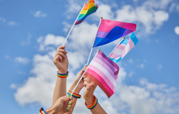 LGBTQ Pride, Hands with a Flags as a Symbol of Lesbian, Gay, Bisexual, Transgender and Queer.