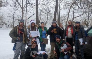 Winter 2016 Ann Arbor field canvass team posing with clipboards in the snow 