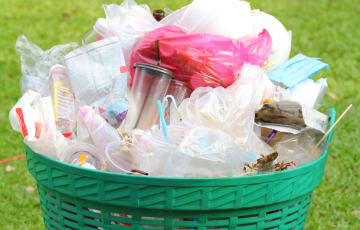 Image of overflowing garbage bin with plastic trash