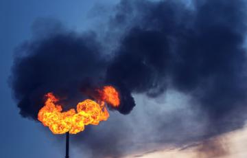 Methane flare, black smoke. Photo credit: Leonid Ikan / Shutterstock