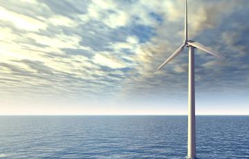 Image of an offshore wind turbine in the ocean