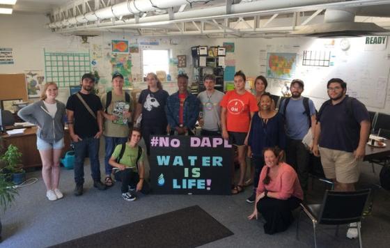 Clean Water Staff posing with "No DAPL - Water Is Life!" sign