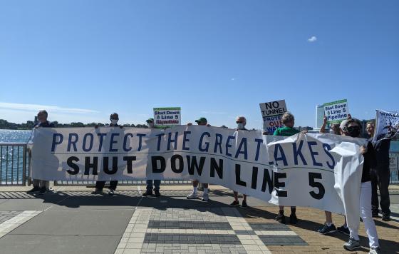 Protestors holding banner: Protect the Great Lakes Shut Down Line 5. Source: Jennifer Schlicht