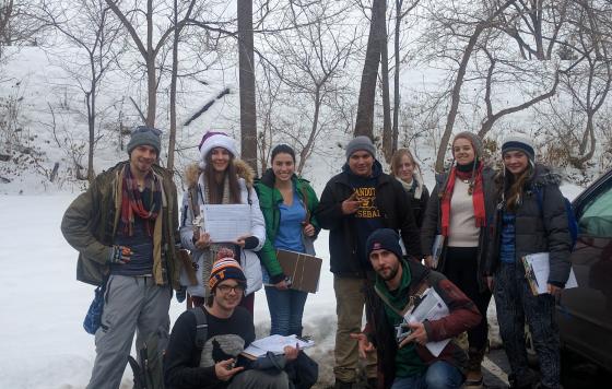 Winter 2016 Ann Arbor field canvass team posing with clipboards in the snow 