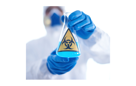 Image of a scientist holding a test tube with blue liquid and with toxic sign on the front of it.