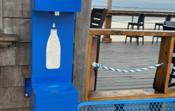 Water bottle refilling station near waterfront outdoor seating