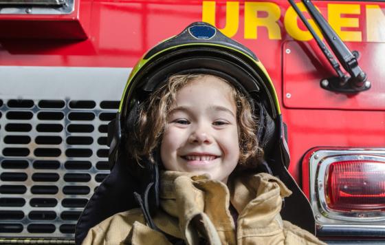 MA_istock_young-girl-wearing-fireman-coat-and-helmet.jpg